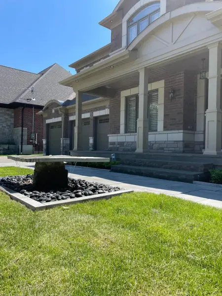 Front garden bed with a water feature