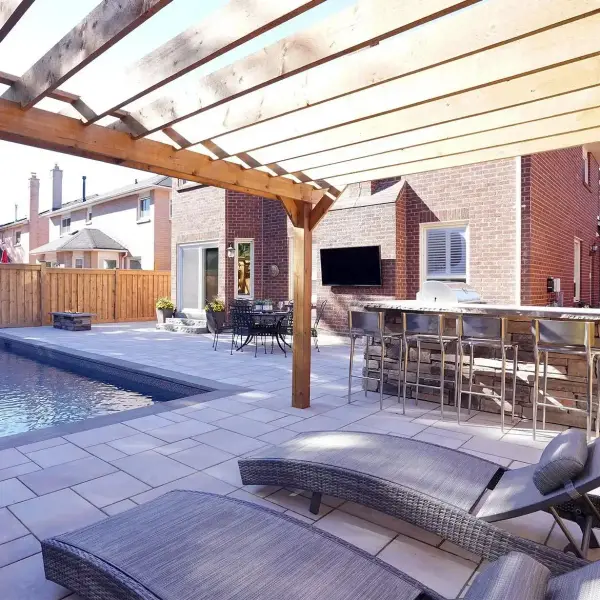 Wood pergola with a bar and TV beside the pool