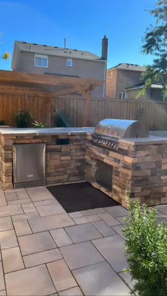 Stone outdoor kitchen with a built-in grill