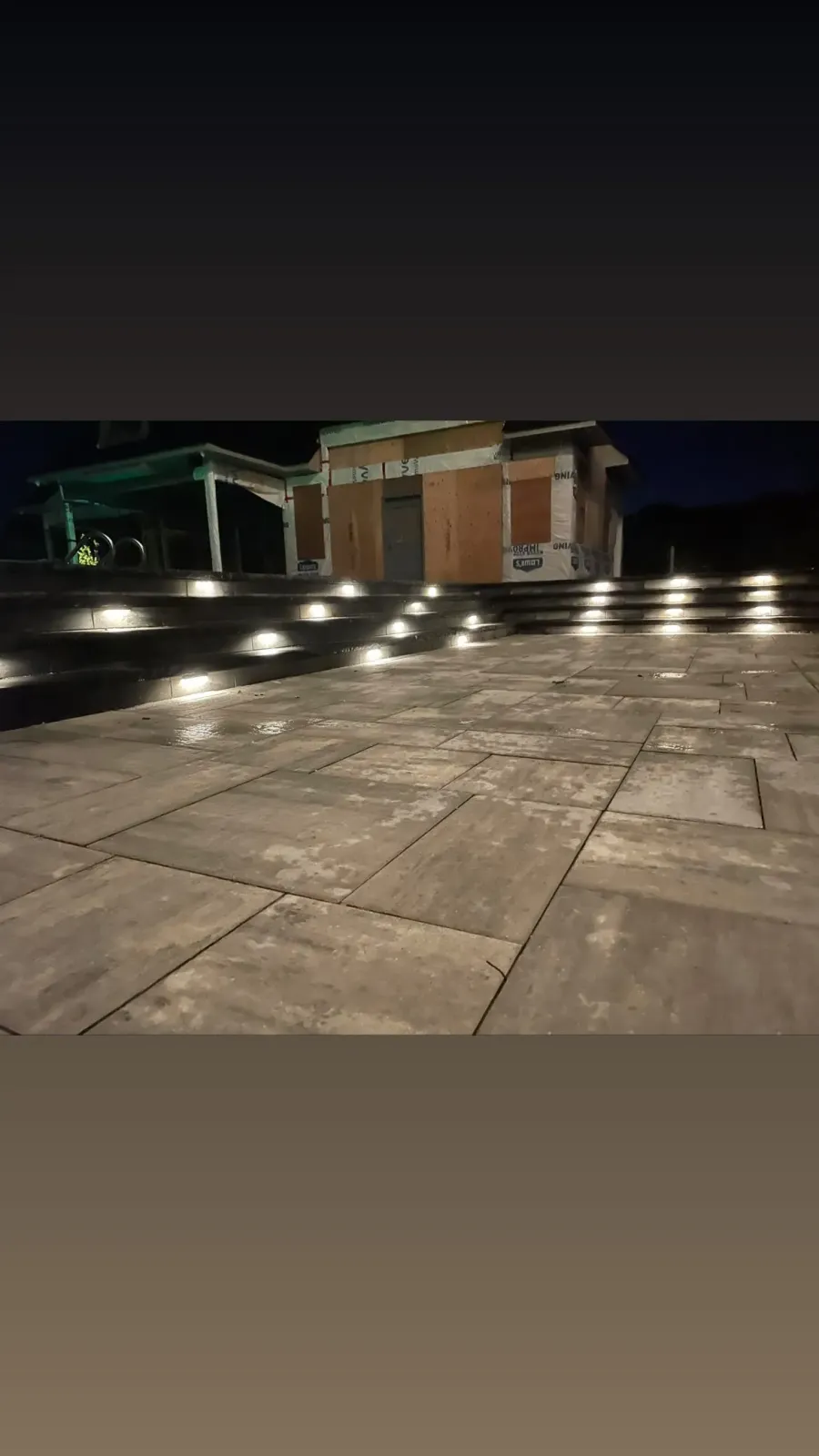 Landscape lighting on steps and patio at night
