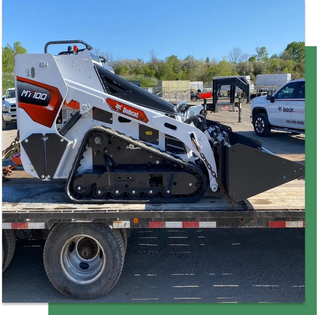 The Bobcat MT100 loaded on a flatbed for delivery
