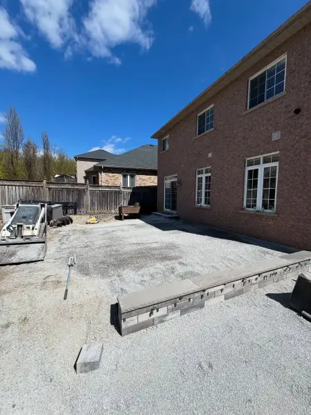 Graded base being prepared for pavers
