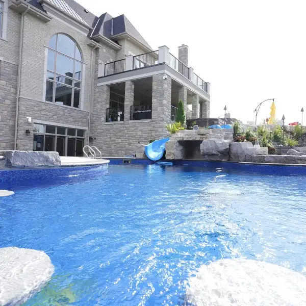 Pool and spa beside the covered outdoor kitchen
